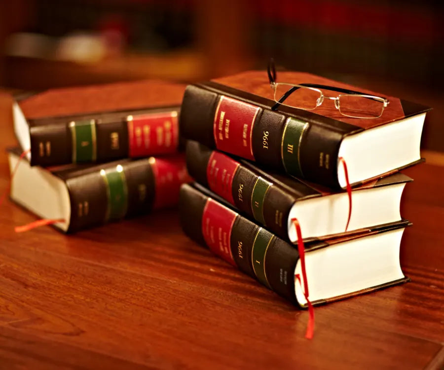 Stack of law books on a desk